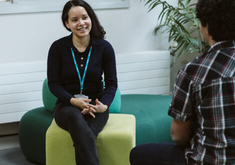 Staff member talking to student