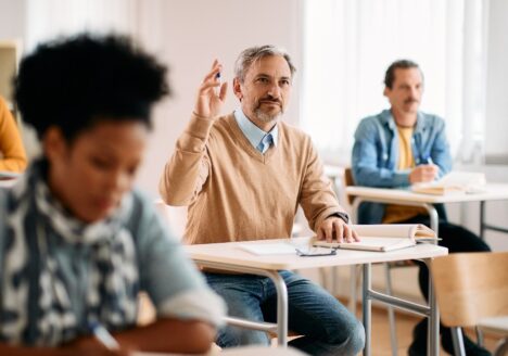 Adult learner raising hand