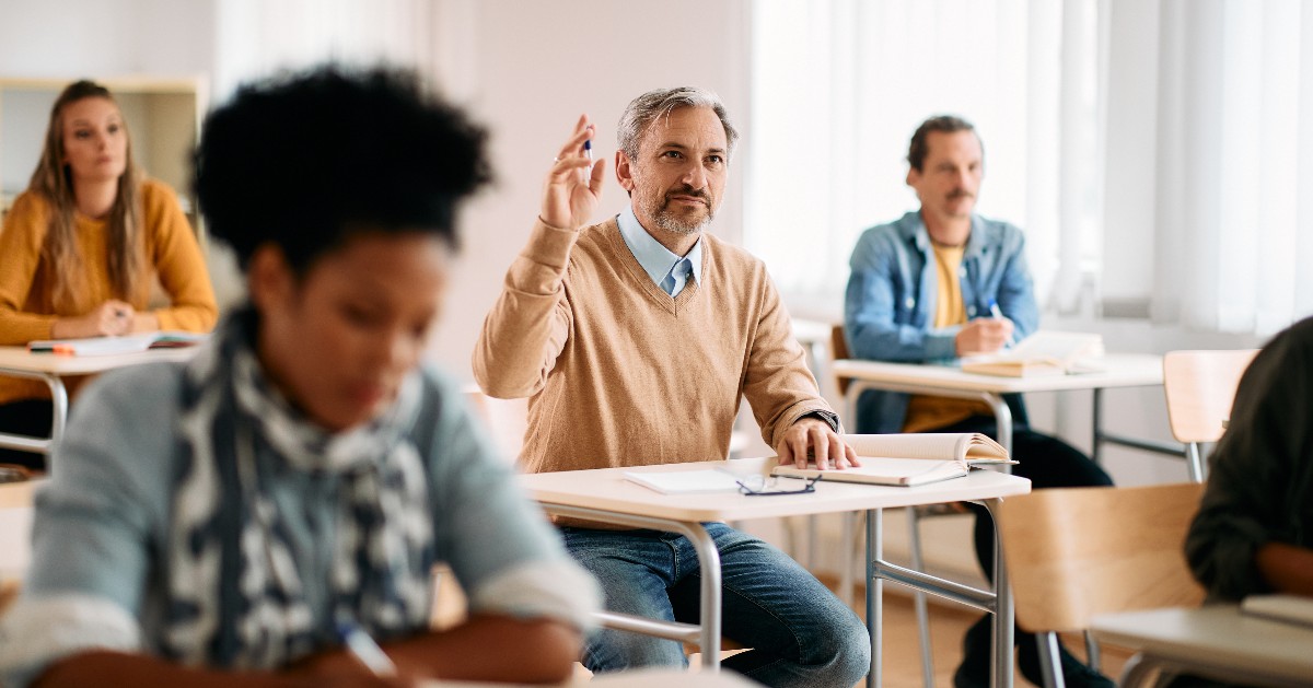 Adult learner raising hand