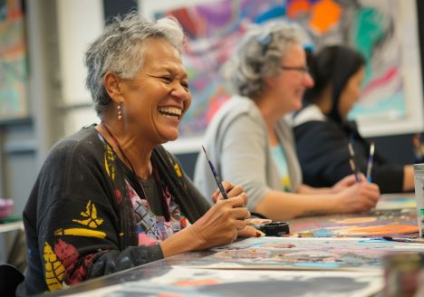 A lady smiling in class